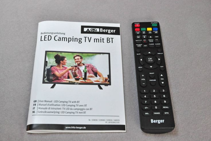 Handbuch und Fernbedienung des Berger Camping TV LED. 